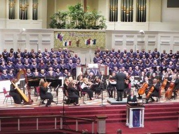 Choir singing with orchestra.